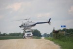 Helicopter spraying, 121 atop truck