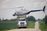 Helicopter spraying, 124 atop mixing&nbsp;truck