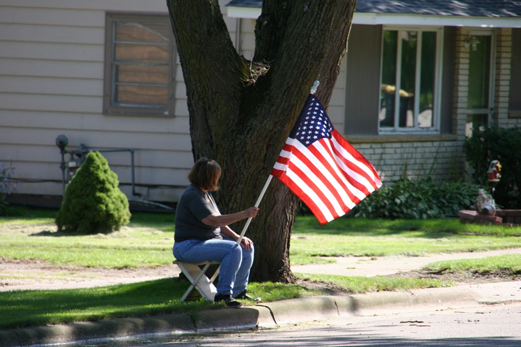Vietnam Memorial Wall processional, #1 woman waiting with flag