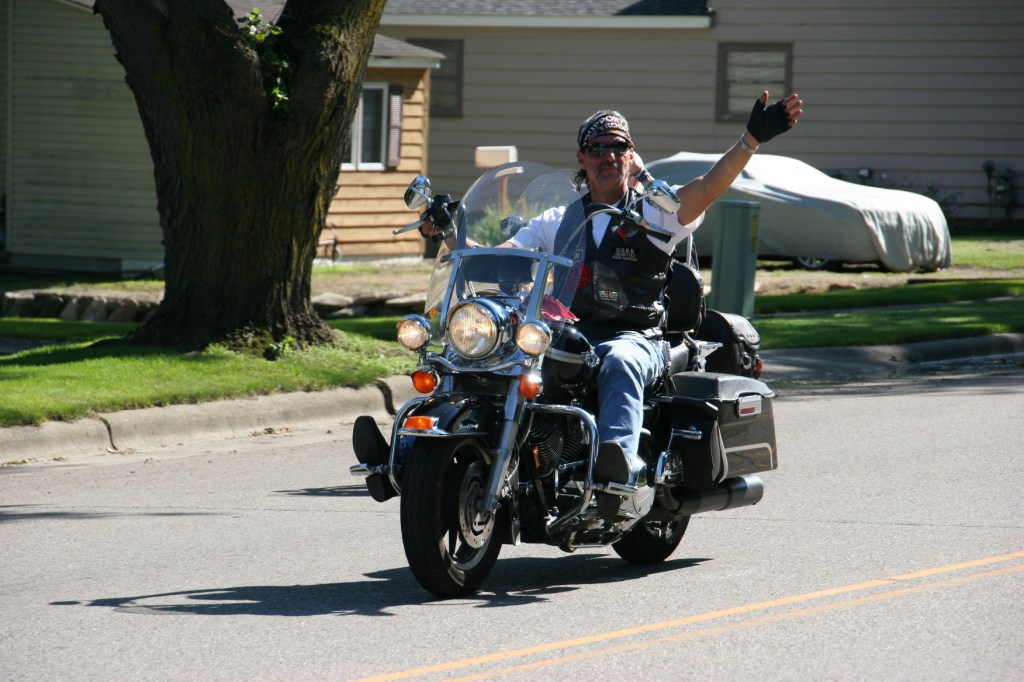 Vietnam Wall Memorial processional, #49 biker waving