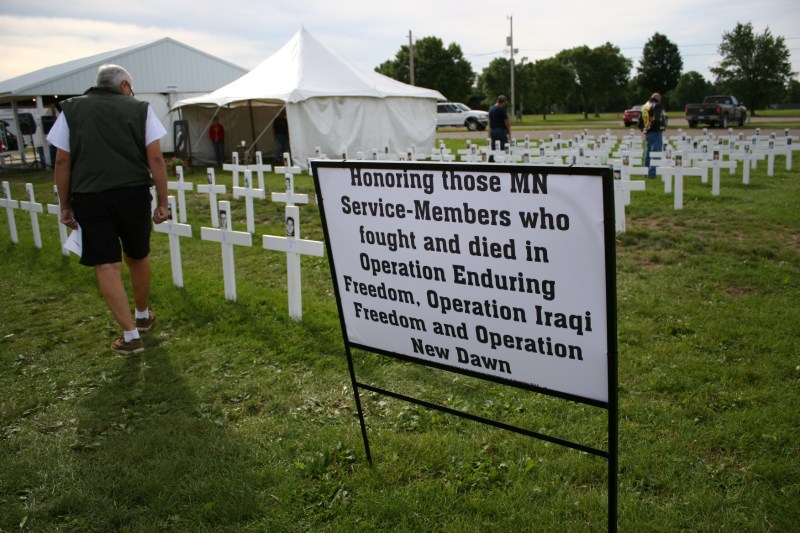 Visitors peruse the crosses honoring the most recent war dead from Minnesota.
