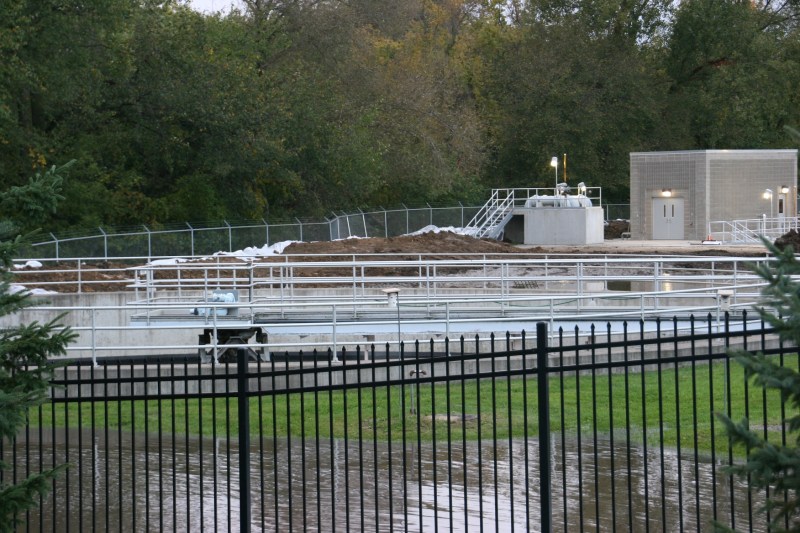 A hastily built berm and sandbags protect the treatment plant.