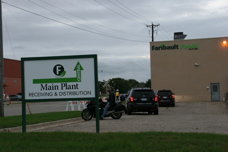 Three police vehicles pulled into the Faribault Foods parking lot to check on folks checking out the flooded river along Second Avenue.