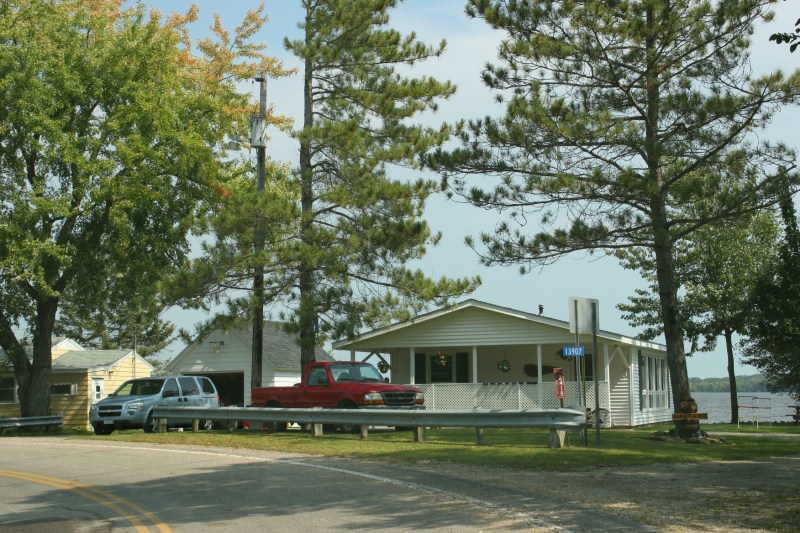 Just down the tree-lined road from Kamp Dels, leaves are changing color on lakeside trees.