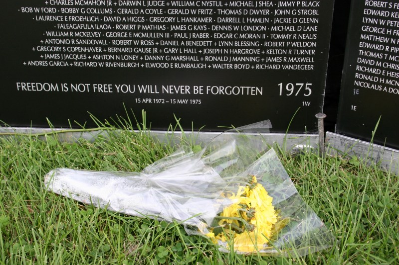 Visitors left bouquets to honor fallen soldiers.
