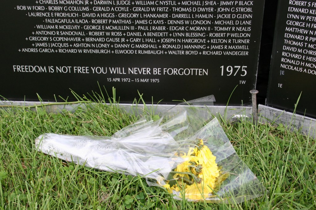 Visitors left bouquets to honor fallen soldiers.