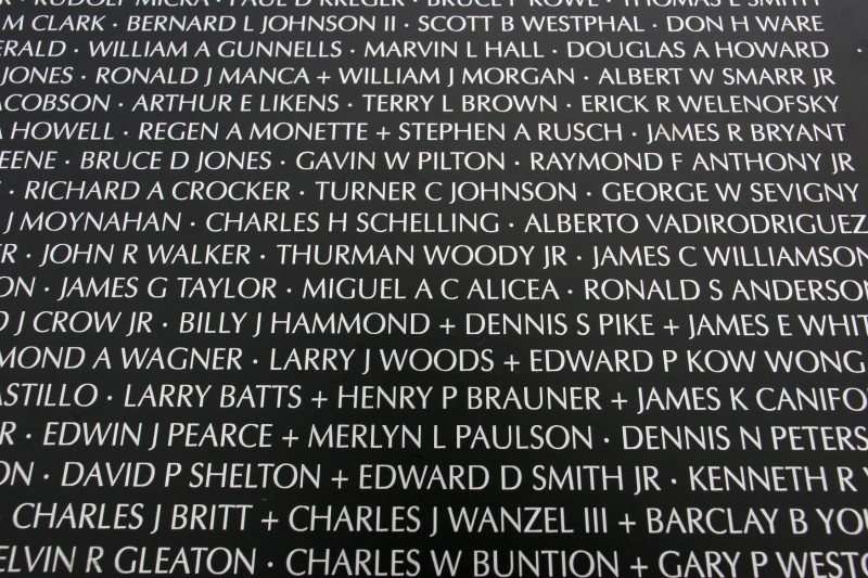 A close-up of names on the Traveling Vietnam Memorial Wall.