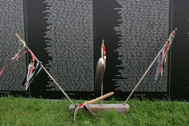 Ceremonial feathers and a peace pipe honor Blair Two Crow.