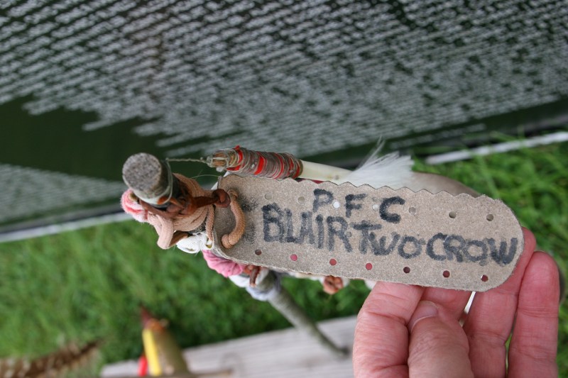 Looking down at Blair Two Crow's memorial placed next to the traveling wall.