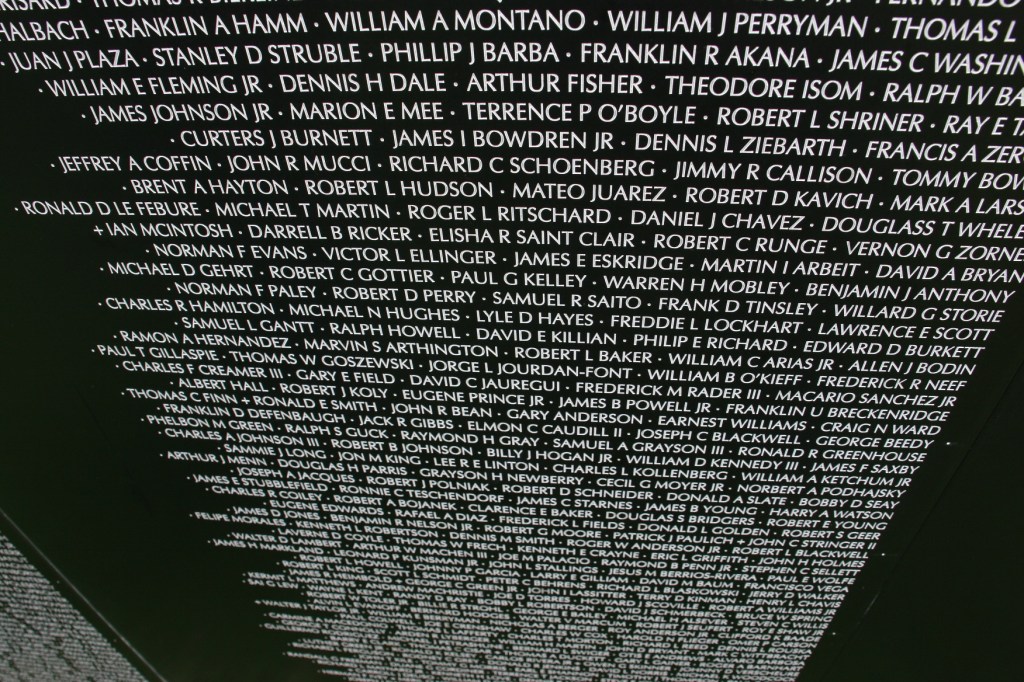 I lifted my camera and pointed the lens down at a panel filled with names of soldiers.