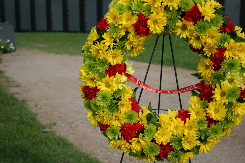 Multiple wreaths featured words of remembrance.