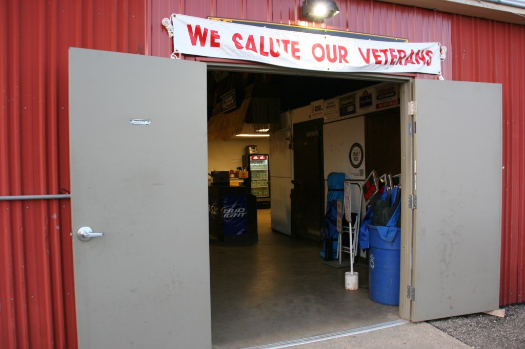 Signage welcomes veterans only to the veterans' lounge.