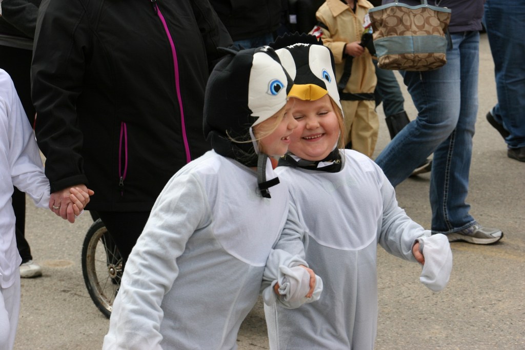 costume-parade-205-penguins-holding-hands