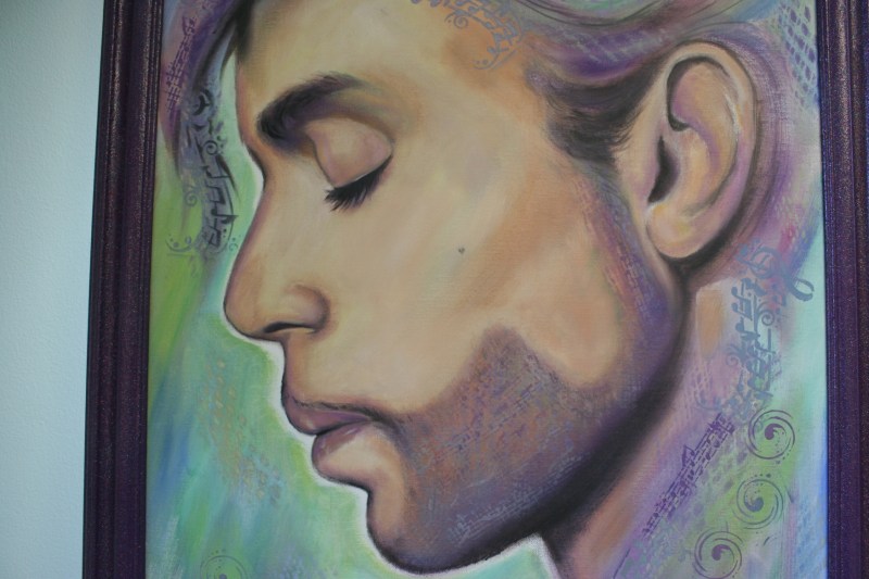 Dana used a stencil to incorporate musical notes in to this painting of Prince. Notice the detail of the heart-shaped mole on the musician's cheek.
