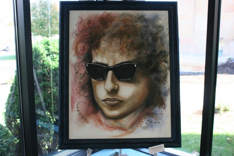 "Bob Dylan: A Voice to be Remembered," a 22 x 28-inch oil portrait by Dana Hanson priced at $1,400.