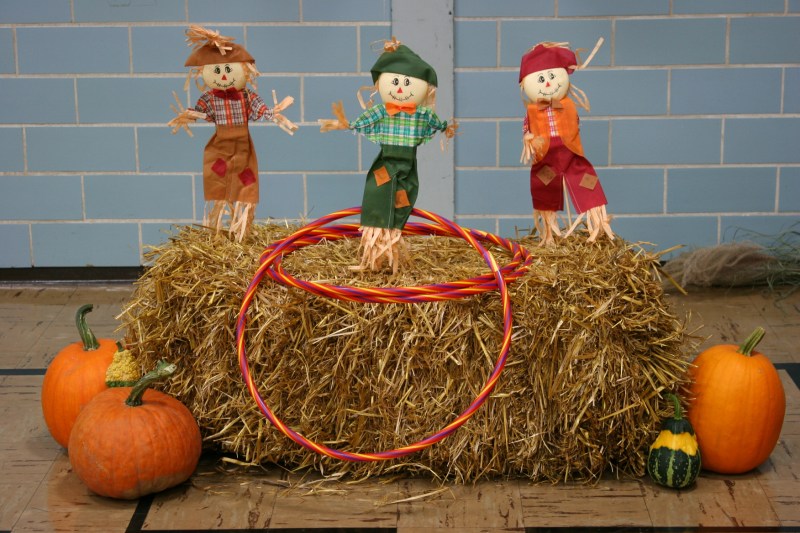 This game involves tossing hoops over scarecrows.