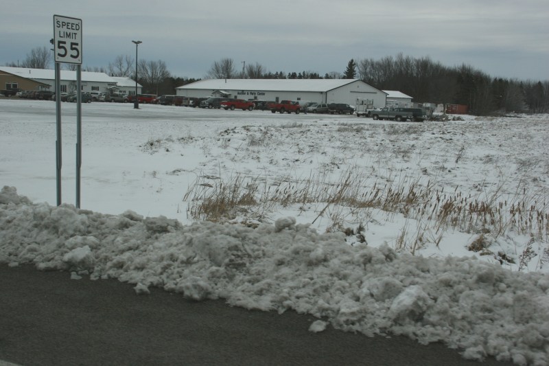 The heavy, wet snow is piled now along the roadside, here in Foley.