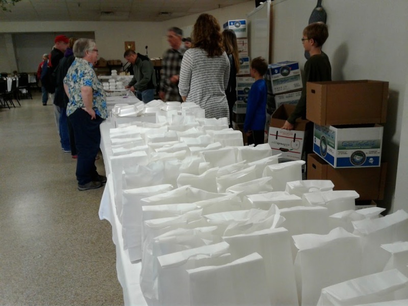 Bagged lunches await pick up by guests and by those delivering meals to homes.