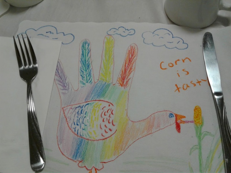 Kids decorate placemats.