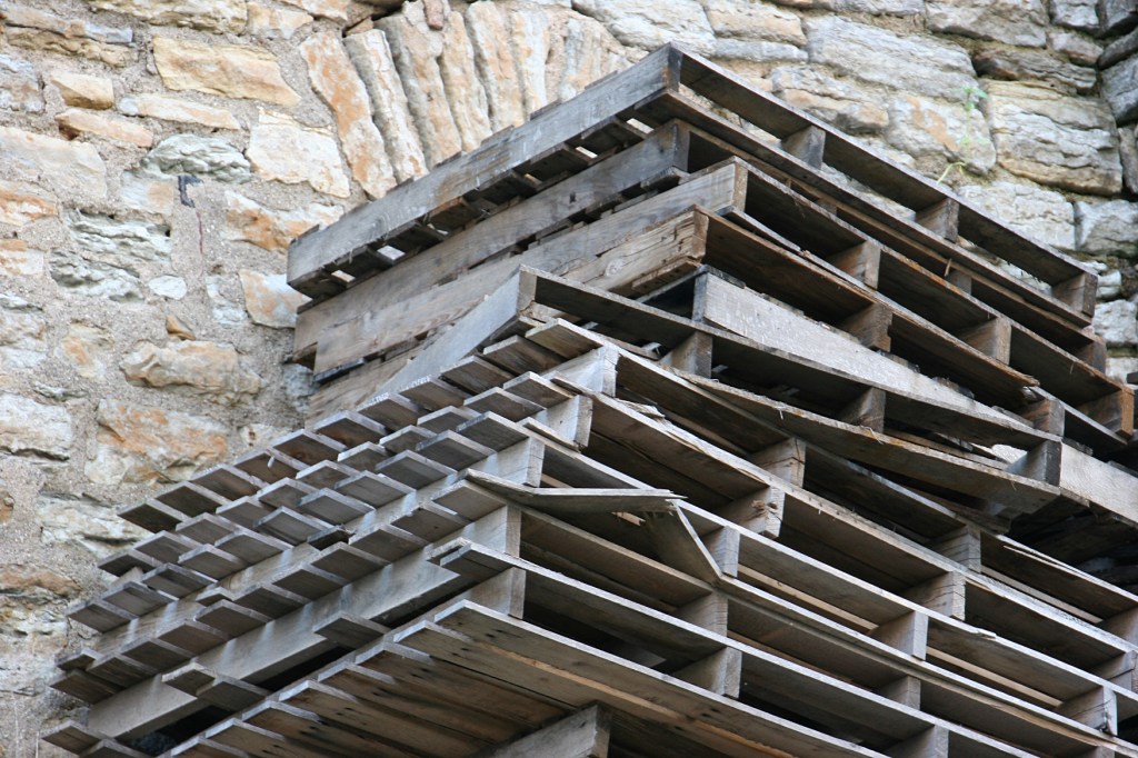 trail-10-pallets-stacked-by-limestone-building