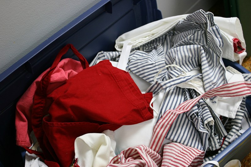 Volunteers can reach into this tub for aprons.