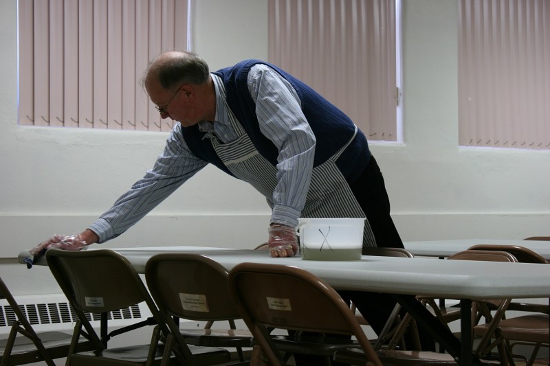 Washing tables after 210 meals were served.