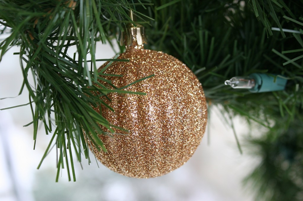 An ornament sparkles on one of many Christmas trees on campus.