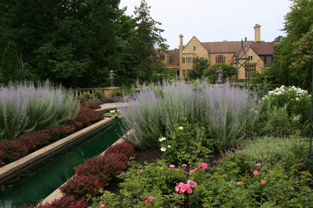A view of The Paine Art Center from the reflecting pond garden located behind the historic 1920s mansion.