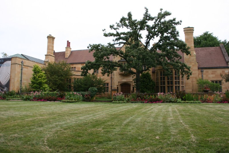 A lawn sweeps to the majestic front entry of The Paine.