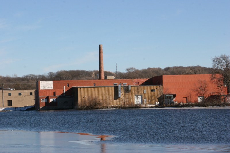The back of the mill as photographed from the North Link Trail. The mill is on the National Register of Historic Places. Several years ago the city of Faribault received a $300,000 Minnesota Historical Cultural Heritage grant for rehab of the smokestack.