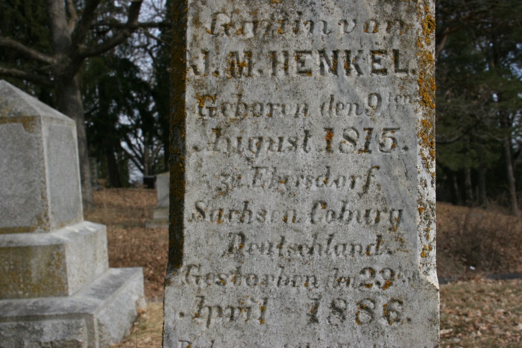 A tombstone inscribed in German.