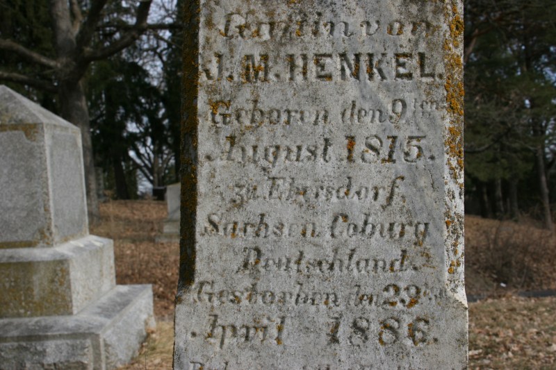 A tombstone inscribed in German.