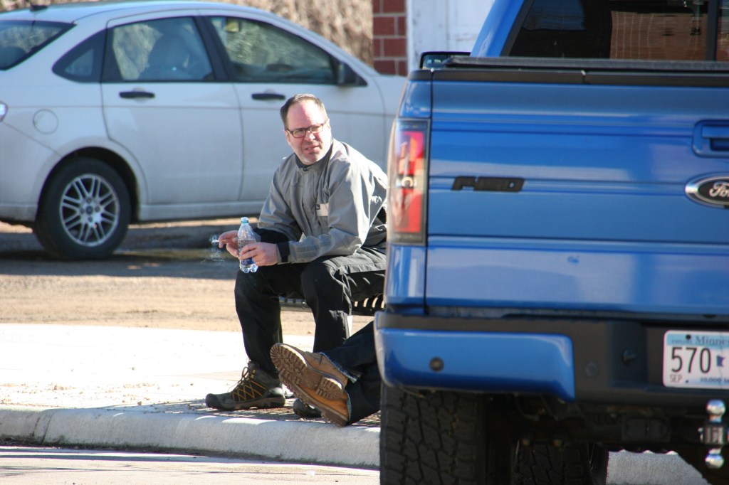 Two guys rested on a bench Saturday afternoon in downtown Jordan.