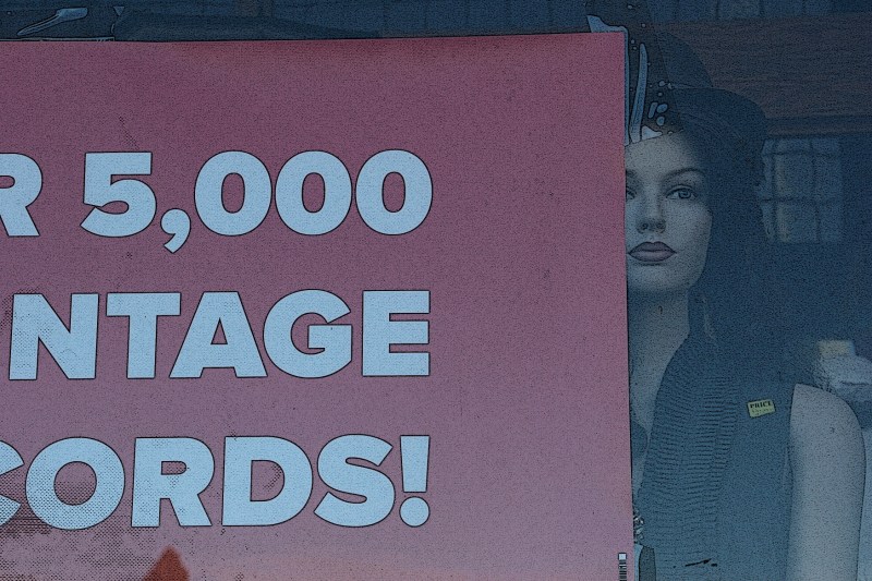 It was the mannquin peeking from behind the sign that prompted this photo at Vintique.