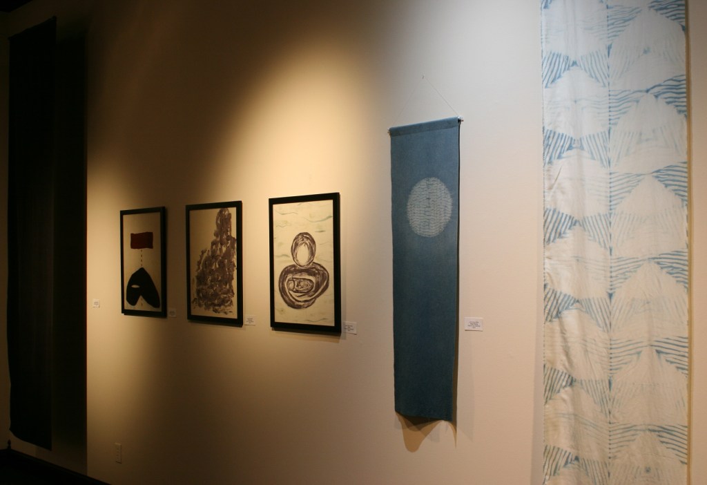 This series of fiber art pieces by Northfield artist Judy Saye-Willis also honors Barb Larson. The pieces, from left to right, are titled "Darkness of Death 1", "Darkness of Death 2", "Destruction", "Hope", "Hope Rising" and "The Light of Hope".