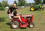 Ag show, #103 boys on lawn&nbsp;tractor