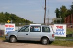 Car lot, #86 van by sign