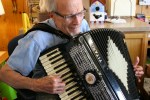 Flour Sack Antiques, #157 closeup of accordion player