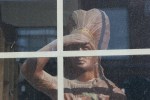 Misc from Sleepy Eye, #85 wooden chief in window