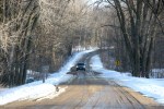 Snowy scenes in MN, #68 car on gravel road