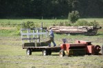 Backroads, #143 lifting bale while baling&nbsp;hay