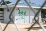 Kenyon park, #7935 Kenyon pool building up close through&nbsp;fence