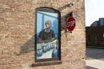 Kipp murals, #1027 woman & stop sign on&nbsp;corner